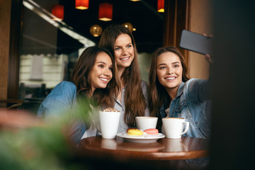 Friends Having Fun, Taking Photos In Cafe.