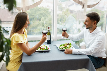 Beautiful Couple In Love On Romantic Date In Restaurant.