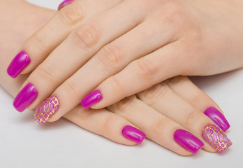 beautiful female hands with pink nail polish on a white background, spa treatments