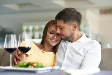 Couple In Love Drinking Wine In Restaurant.