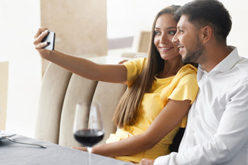 Happy Couple. Smiling Couple Taking Photo In Restaurant.