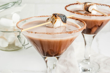 New Year and Christmas drinks idea, Toasted smores martini, white background, copy space