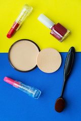 Cosmetics and fashion background with make up artist objects: lipstick, eye shadows, mascara ,eyeliner, concealer, nail polish. Lifestyle Concept.