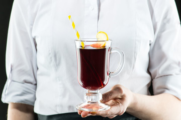The unidentified waiter brings a hot non-alcoholic mulled wine with orange and cinnamon