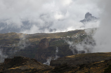 Fototapeta na wymiar Toscón village and Roque Bentaiga in the background. The Nublo Rural Park. Tejeda. Gran Canaria. Canary Islands. Spain.