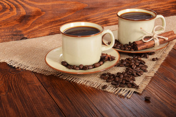 black sweet coffee in brown cups with vanilla cane and anise flower with free space for text
