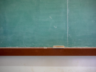 Fototapeta blank classroom chalkboard with eraser and chalk obraz