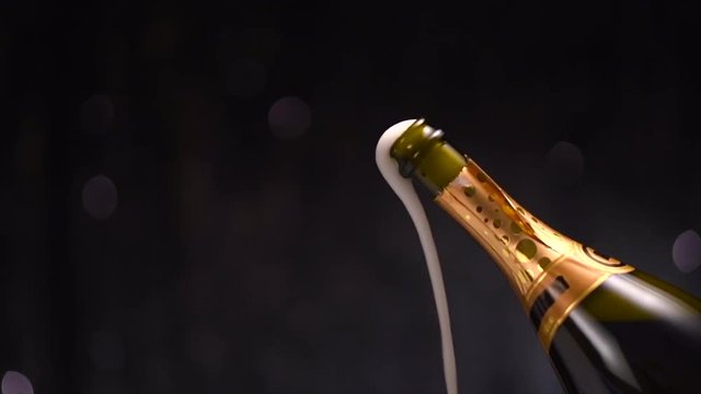 Champagne explosion. Sparkling wine popping, opening champagne bottle closeup. Slow motion. 4K UHD video footage. 3840X2160