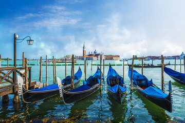 Fototapeta na wymiar San Giorgio Maggiore church and Gondolas in Venice, Italy.