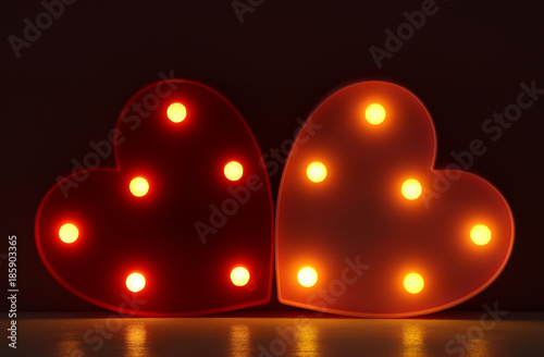 “Valentine’s day background with led glowing hearts.” Stock photo and