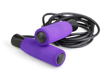 Violet jump rope or skipping rope isolated on white background. Sports, fitness, cardio, martial art and boxing accessories. - obrazy, fototapety, plakaty