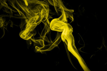 Yellow smoke on black background