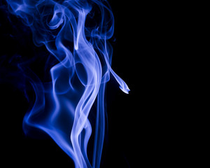 Blue smoke on black background