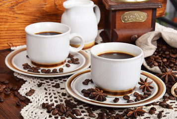 cups of coffee and milk and roasted coffee beans