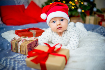 Fototapeta na wymiar Baby in a christmas hat