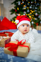 Fototapeta na wymiar Baby in a christmas hat