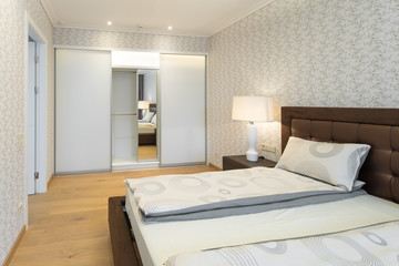 Naklejka na ściany i meble Modern Interior of the bedroom in the apartment..