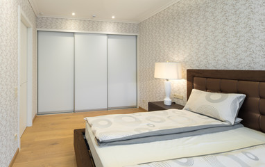 Modern Interior of the bedroom in the apartment..