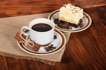 black coffee in a cup with chocolate cake with free space for text