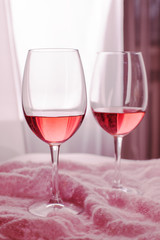 Two glasses with tasty wine in bar, romantic set