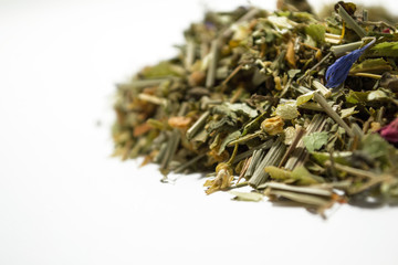 Dry herbal tea. A variety of fragrant herbs for brewing tea. Side view.