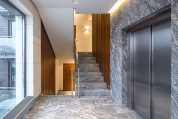 Hall staircase and elevator in a modern block of flats.