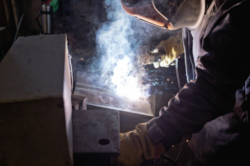 Welder in workshop conditions sample weld from sheet metal to undergo certification