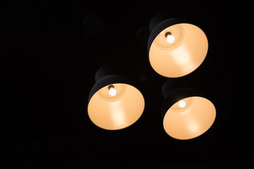 Ceiling tungsten lights with dark background