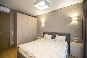 Modern Interior of the bedroom in the apartment..