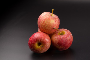 Red apples isolated on a black background