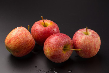 Red apples isolated on a black background