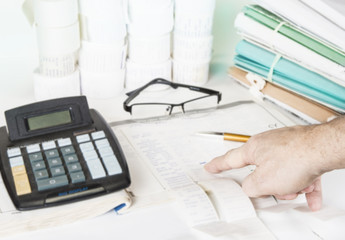 Fototapeta premium Bookkeeping files and tools with eyeglasses. Audit concept.