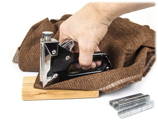 Heavy duty staple gun with staples on the white background