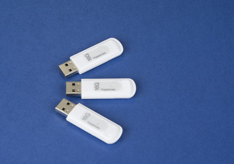USB keys to save data on the bue background