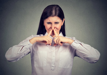 Woman suffering from bad smell