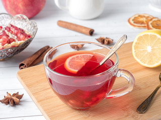 Hot homemade lemonade with pomegranate, lemon and winter spices