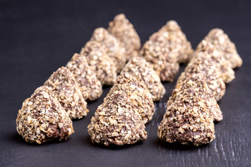 Homemade Fresh Truffle With Cocoa and Peanut Butter Close up Black Background Horizontal