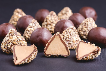 Homemade Fresh Truffle With Cocoa and Peanut Butter Chocolate Candies Black Background Horizontal Close Up