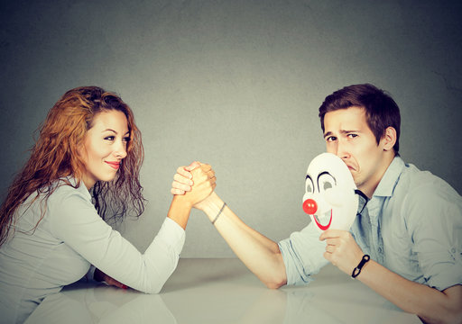 Man and woman having arm wrestling