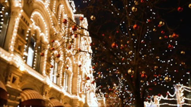Defocused Christmas and New Year decoration (balls and ornaments) in the city