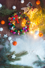 Obraz na płótnie Canvas New Year's still-life with lights, ornaments on a white background.