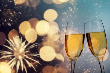 Champagne glasses on sparkling background