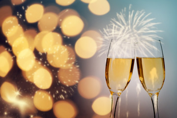 Champagne glasses on sparkling background