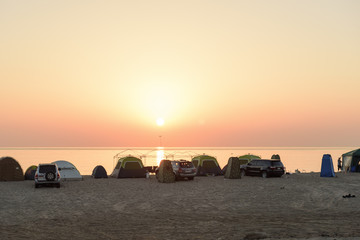 Fototapeta na wymiar Beautiful Sunrise Silhouette in Sharjah Beach. 