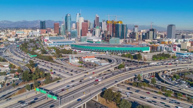 Cinematic urban drone view of downtown Los Angeles and convention center.