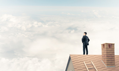 Mister boss on brick roof with arms akimbo. Mixed media