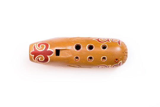 Kazakh traditional sazsyrnai. 
Closeup of a sazsyrnay - kazakh traditional ocarina isolated on white background