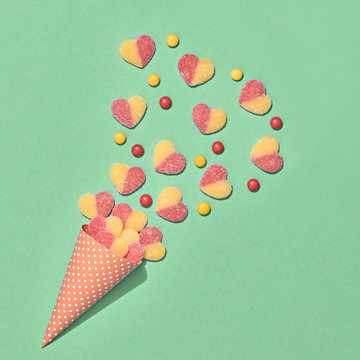 Ice Cream Cone with Gummy Candies. Flat lay. Love,Valentines day concept. Summer Party, Birthday Firework background. Bright Sweet Color. Trendy fashion Style. Minimal. Art.