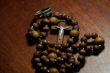 wooden rosary and ring close up