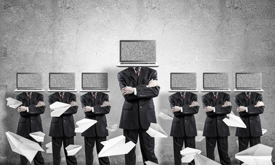 Businessmen with laptops instead of head.